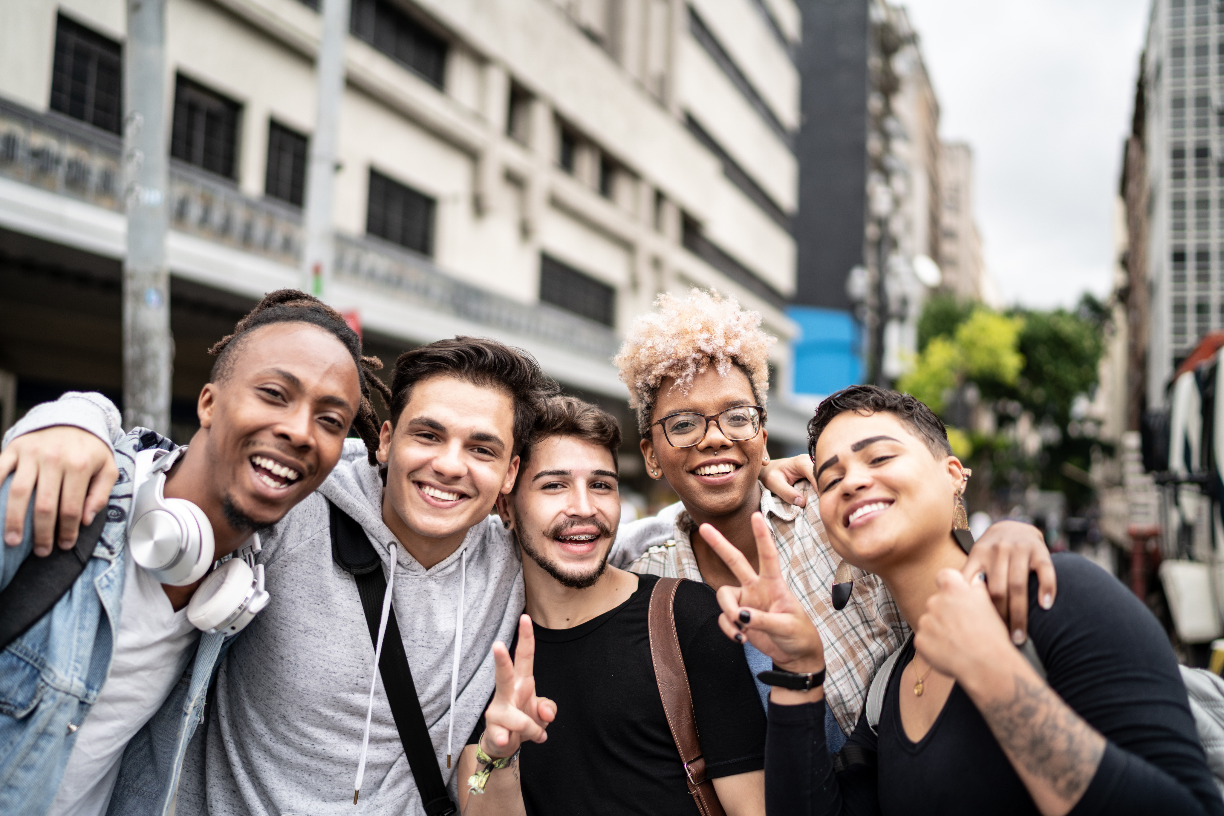 A group of young diverse people taking a photo.
