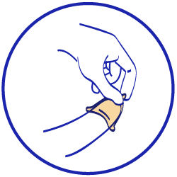 A person placing an external condom on the tip of a penis.