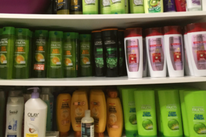 Caracole's cabinets filled with donated shampoos, conditioners, and body wash.